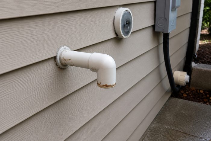 AC condensate drain line on the exterior of a home